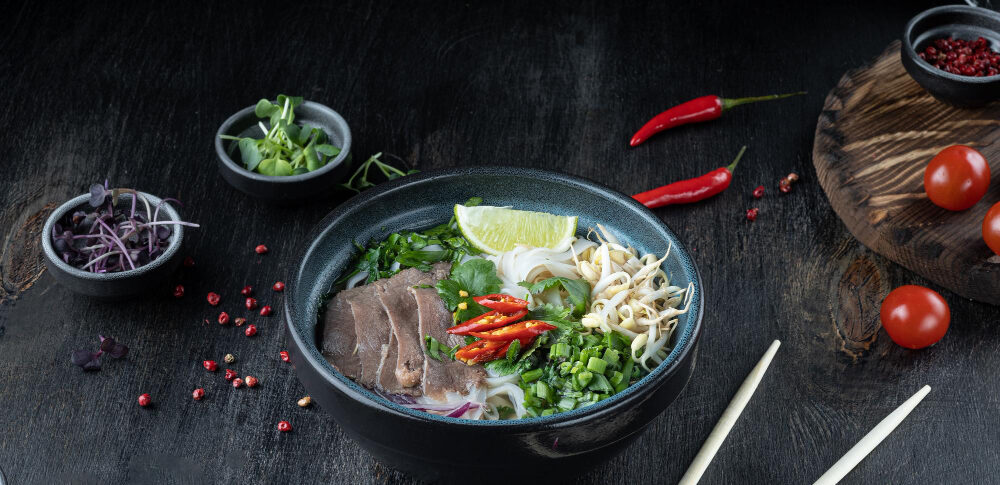 pho-bo-vietnamese-soup-with-beef-dark-background-top-view