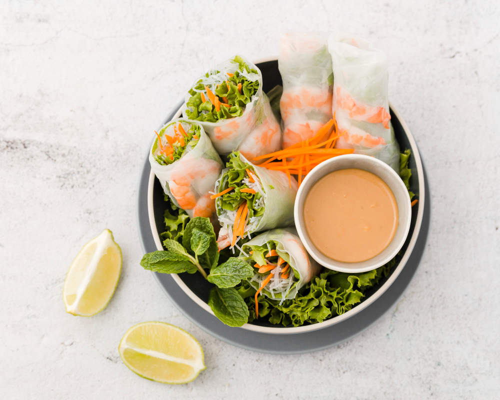 top-view-bowl-shrimp-rolls-with-sauce-lemon